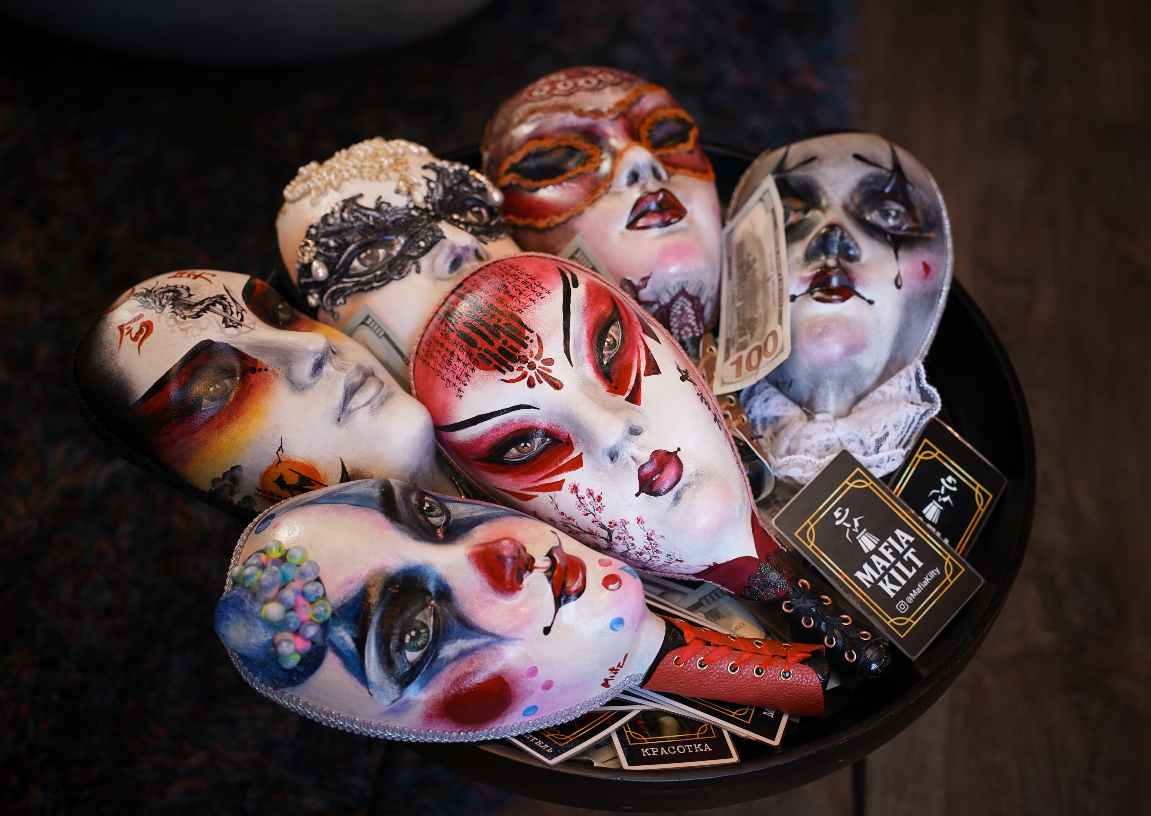 Close-up of ornate Venetian masks worn by players during the game