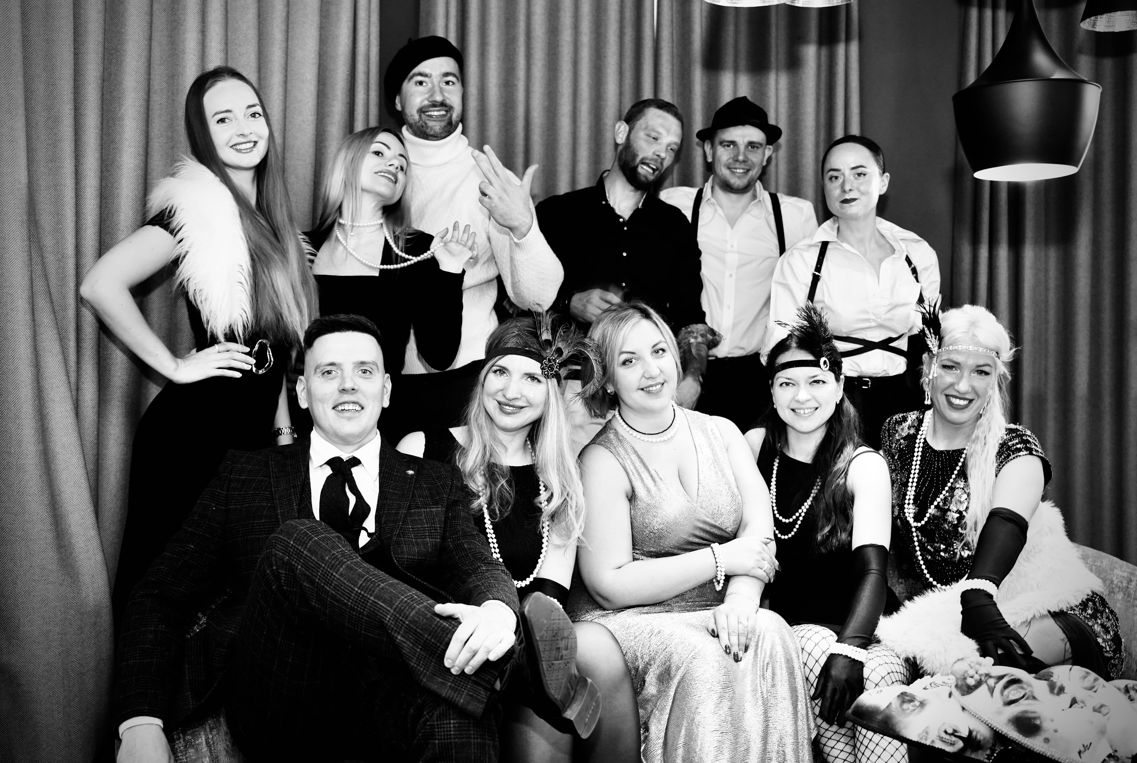 Black and white group photo of Mafia Kilty players after a game night