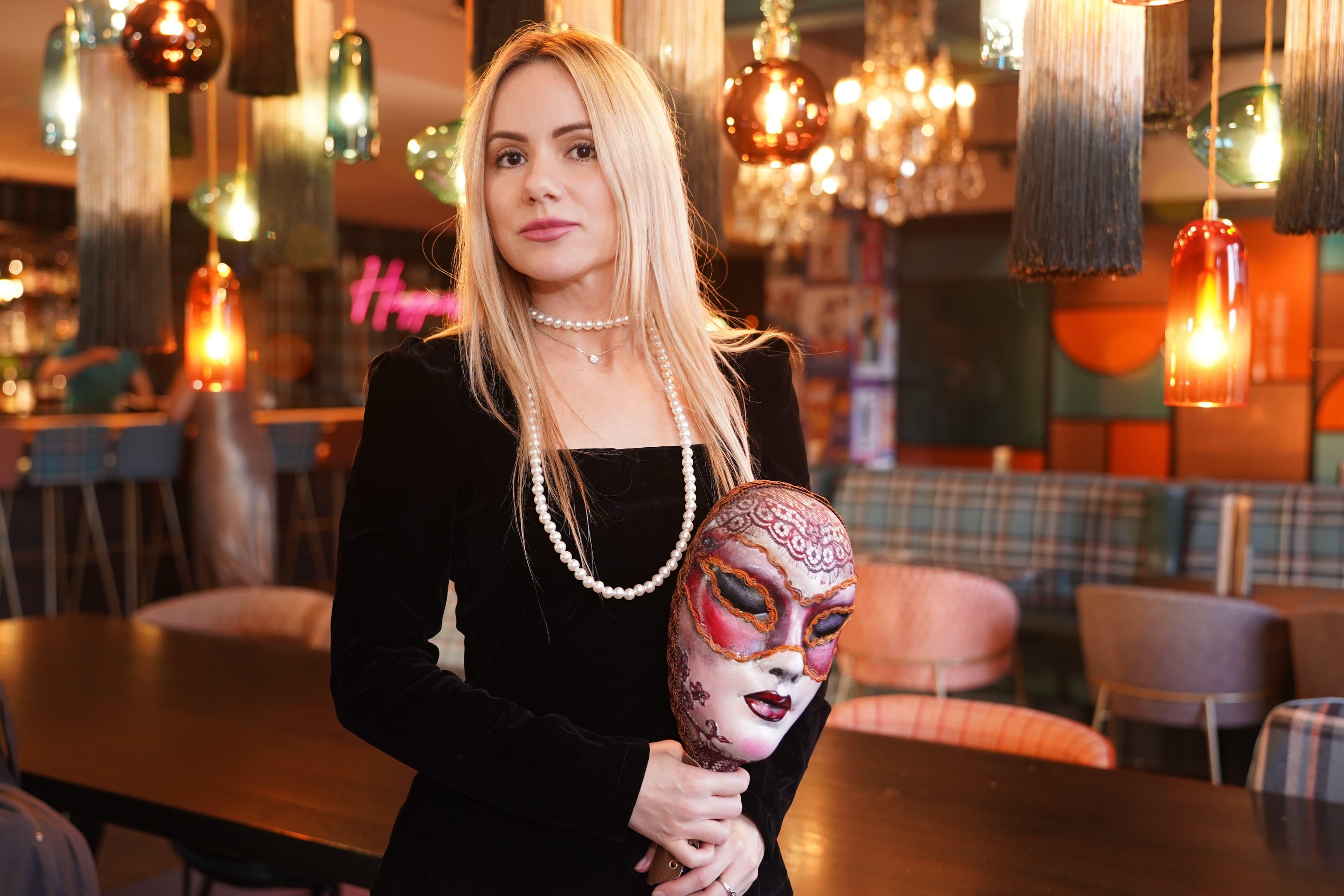 Event host wearing a dramatic mask at a Mafia Kilty night in Edinburgh